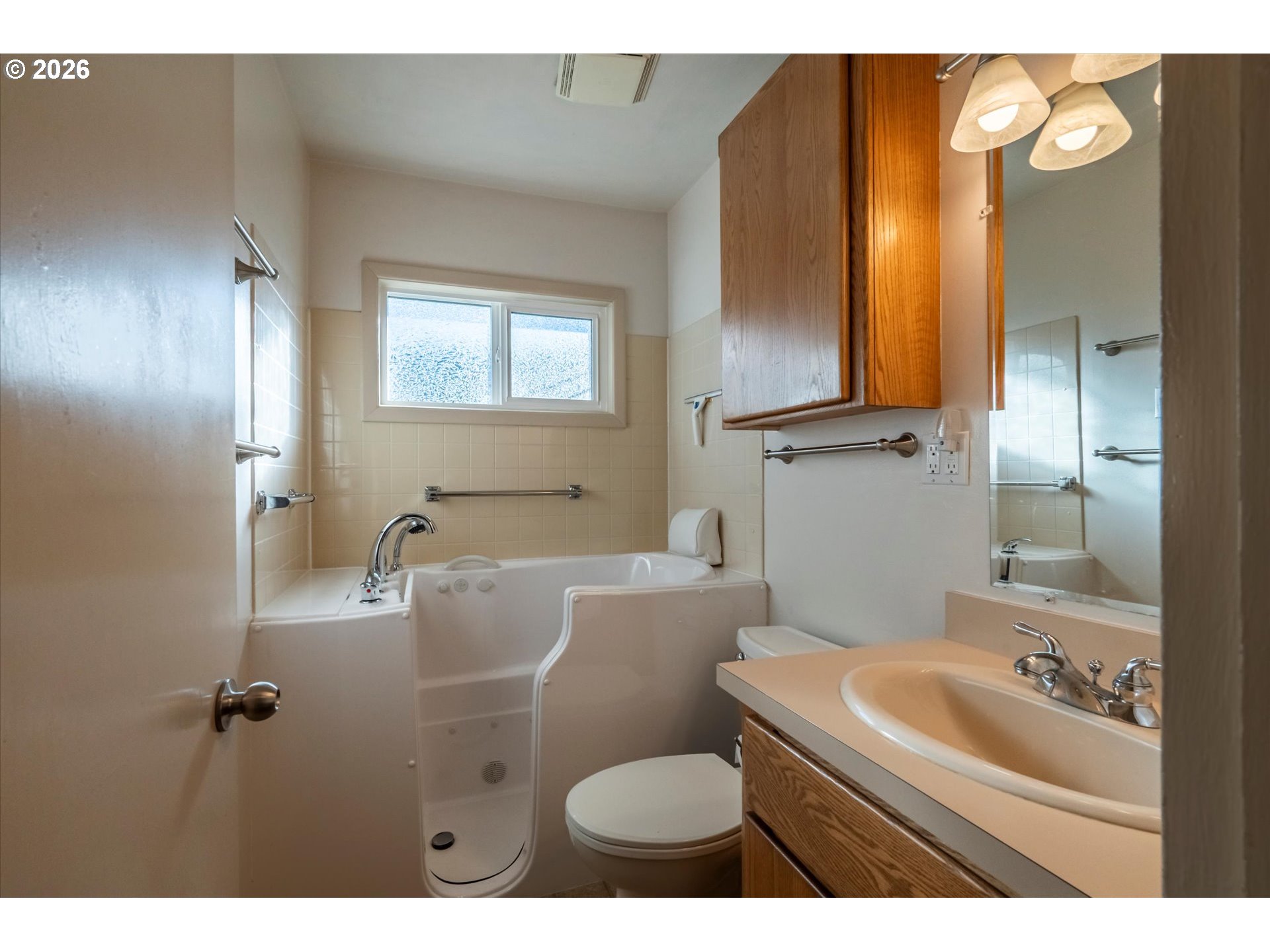 2480 Gardens Avenue Reedsport, OR 97467 - Photo 11 of 22 a bathroom with a granite countertop sink a mirror and a toilet