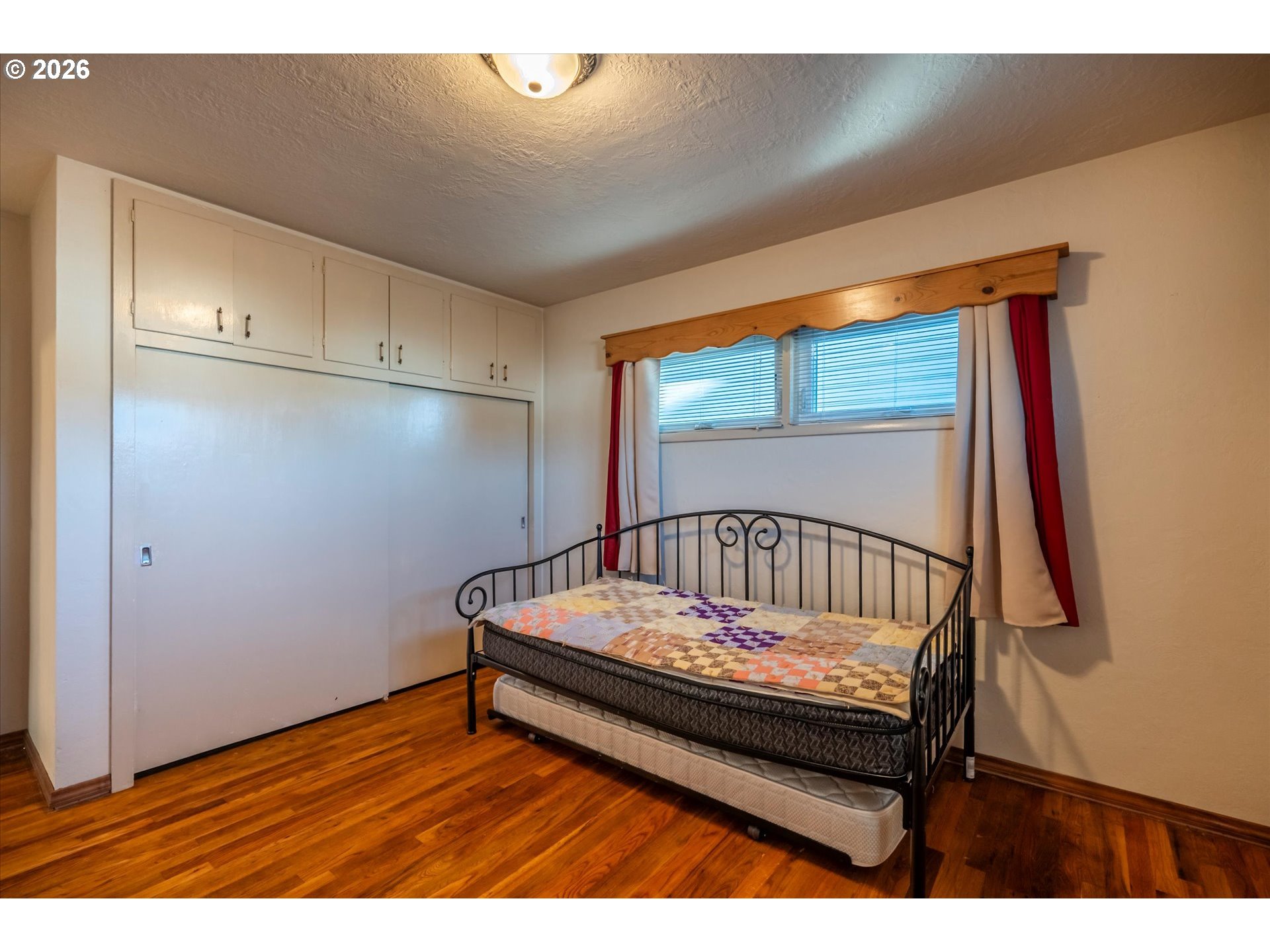 2480 Gardens Avenue Reedsport, OR 97467 - Photo 14 of 22 a bedroom with a bed and a window
