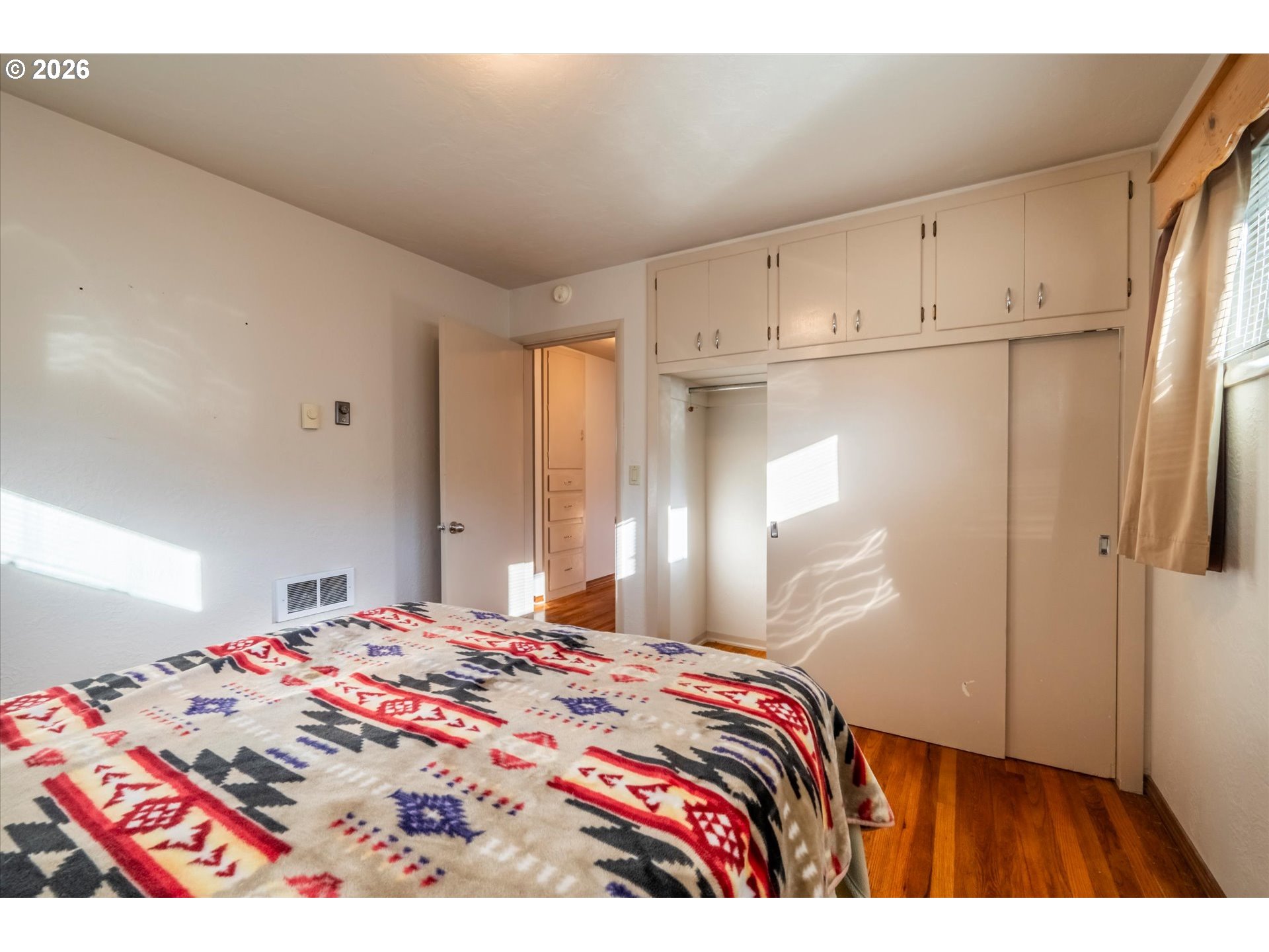 2480 Gardens Avenue Reedsport, OR 97467 - Photo 17 of 22 a bedroom with a bed and a dresser