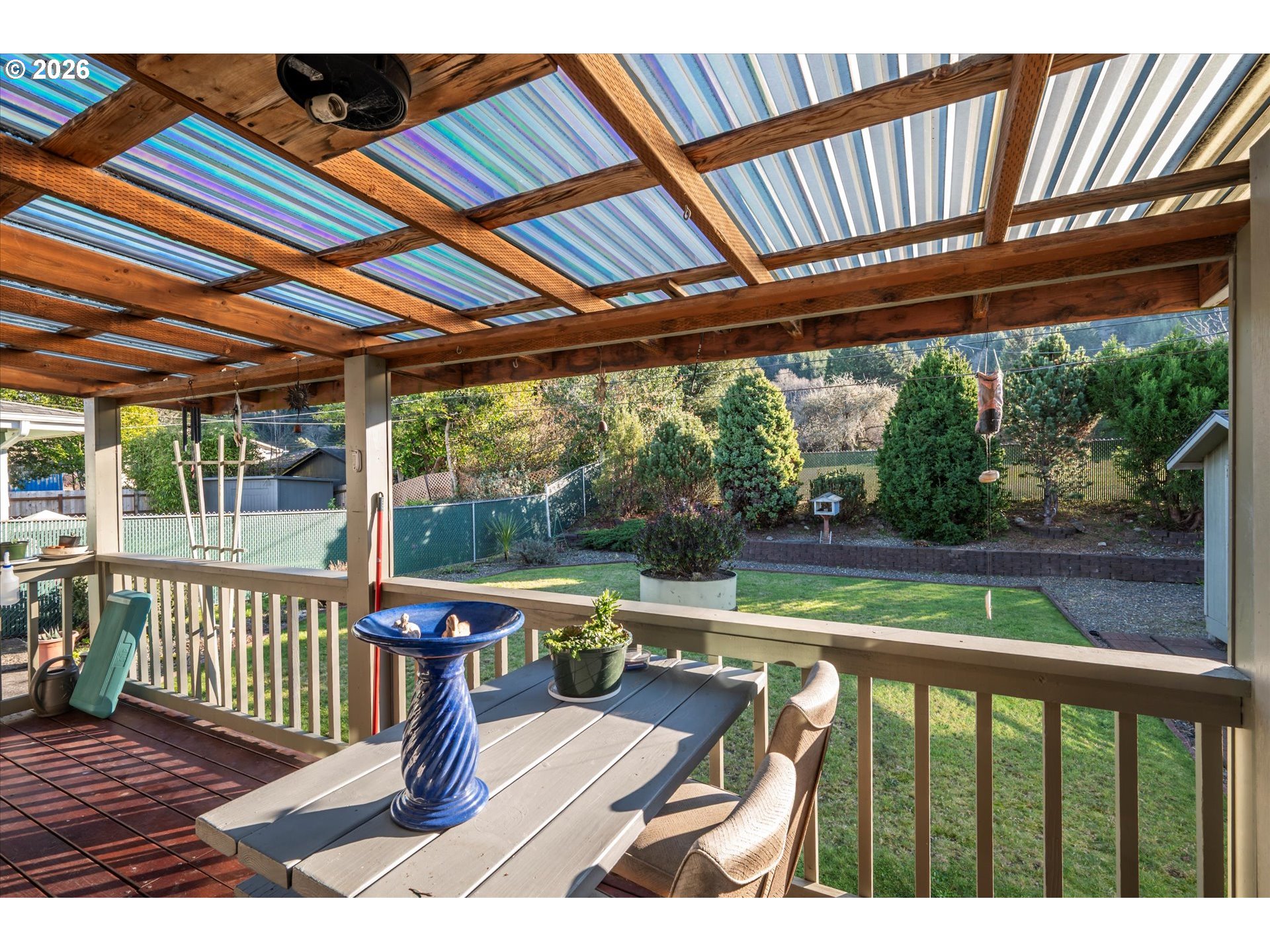 2480 Gardens Avenue Reedsport, OR 97467 - Photo 19 of 22 a view of a porch with wooden floor chairs and table