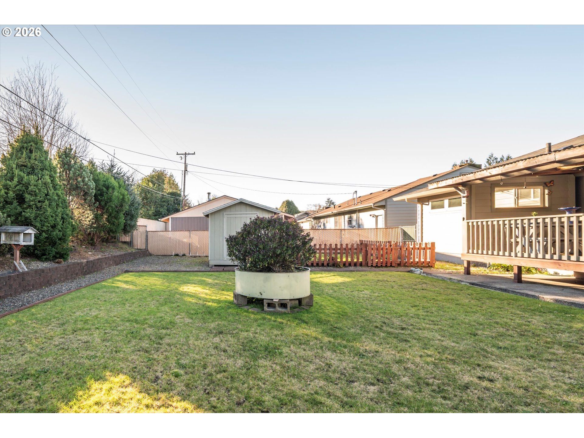 2480 Gardens Avenue Reedsport, OR 97467 - Photo 21 of 22 a backyard of a house with table and chairs
