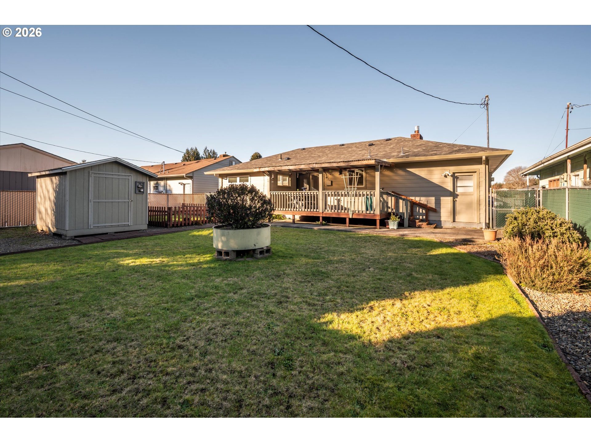 2480 Gardens Avenue Reedsport, OR 97467 - Photo 22 of 22 a view of a house with a big yard and potted plants