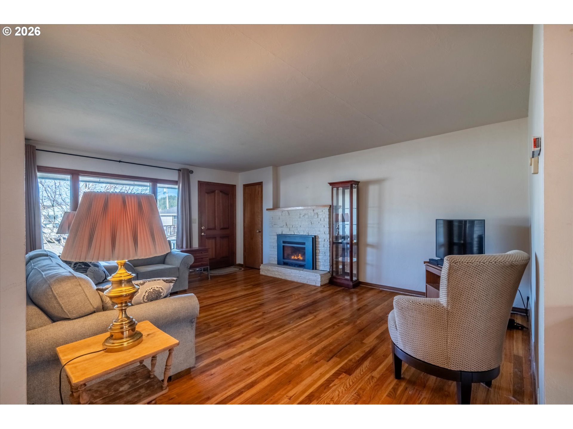 2480 Gardens Avenue Reedsport, OR 97467 - Photo 3 of 22 a living room with furniture and a fireplace