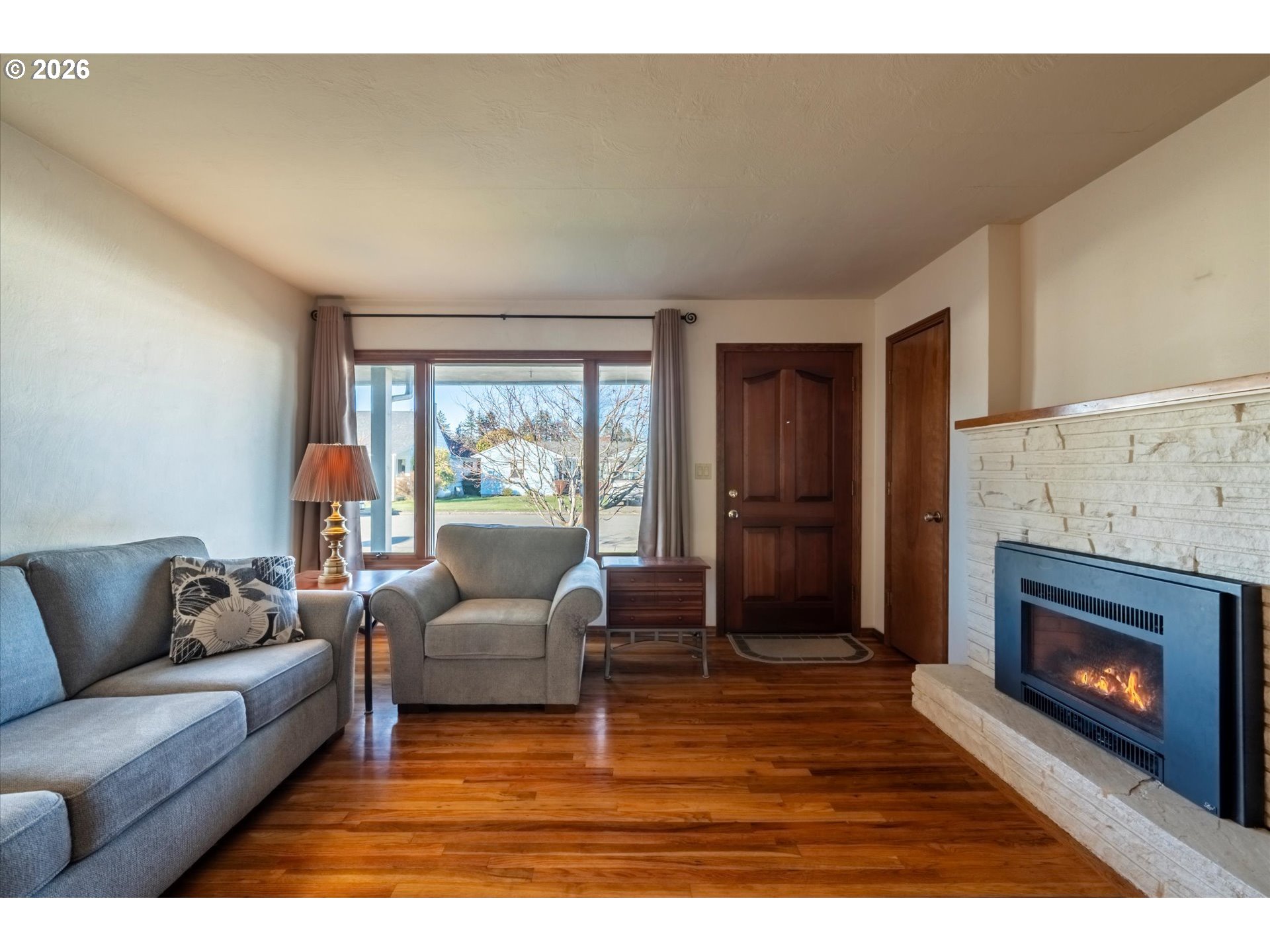 2480 Gardens Avenue Reedsport, OR 97467 - Photo 4 of 22 a living room with furniture and a fireplace