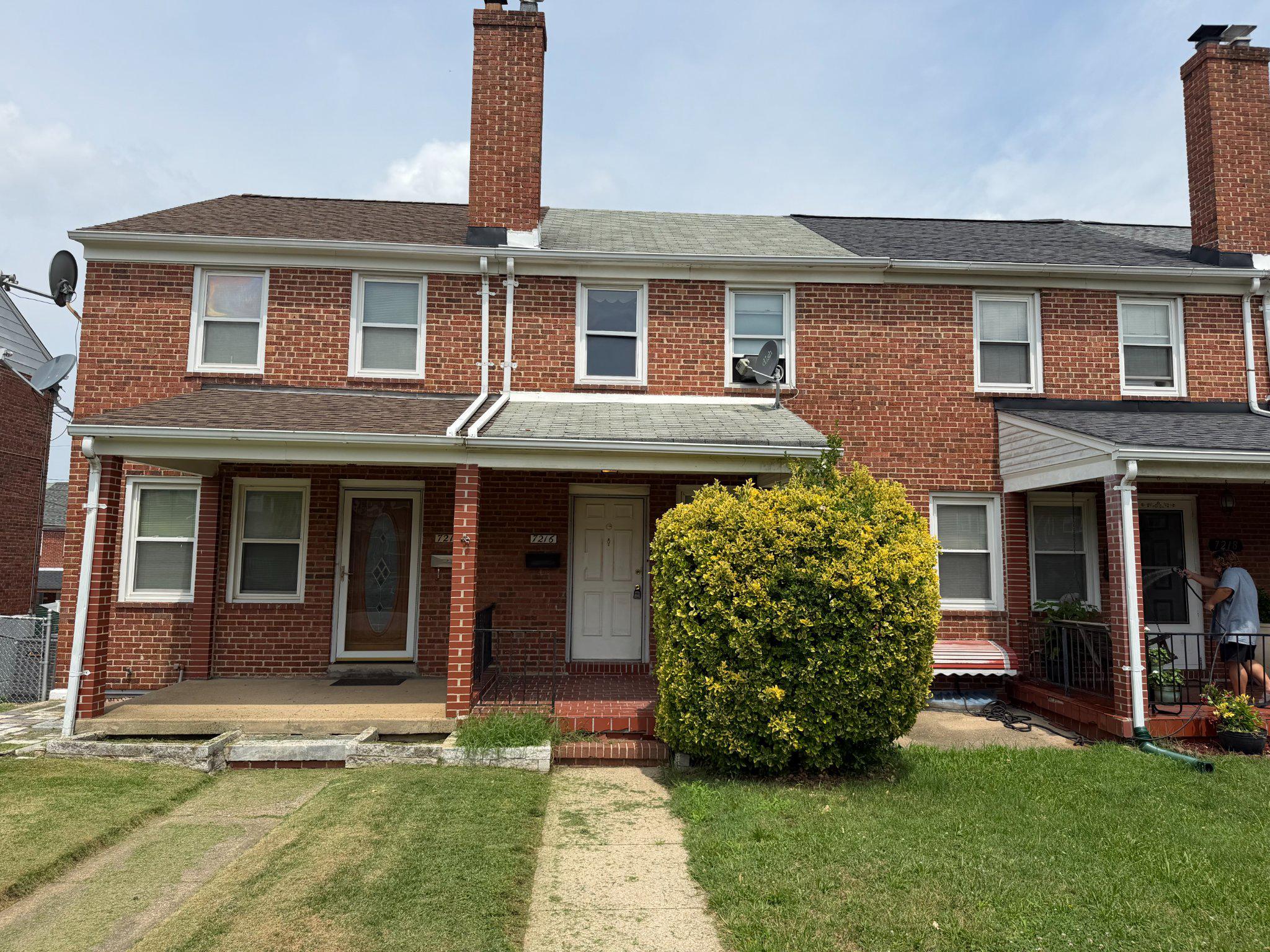 7216 Conley Street Baltimore, MD 21224 - Photo 3 of 14 Charming brick rowhome with lush greenery.