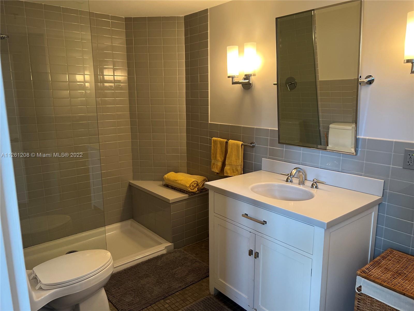 900 4th Street, Unit 2 Miami Beach, FL 33139 - Photo 11 of 15 a bathroom with a sink toilet and shower