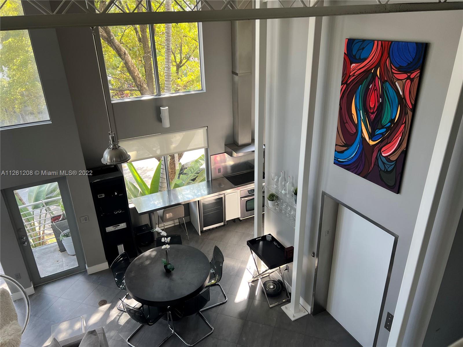 900 4th Street, Unit 2 Miami Beach, FL 33139 - Photo 3 of 15 a living room with furniture and a window