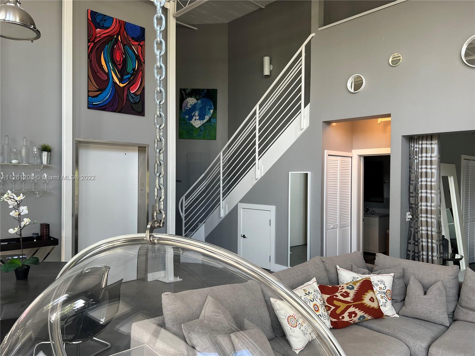 900 4th Street, Unit 2 Miami Beach, FL 33139 - Photo 4 of 15 a living room with furniture and painting on the wall