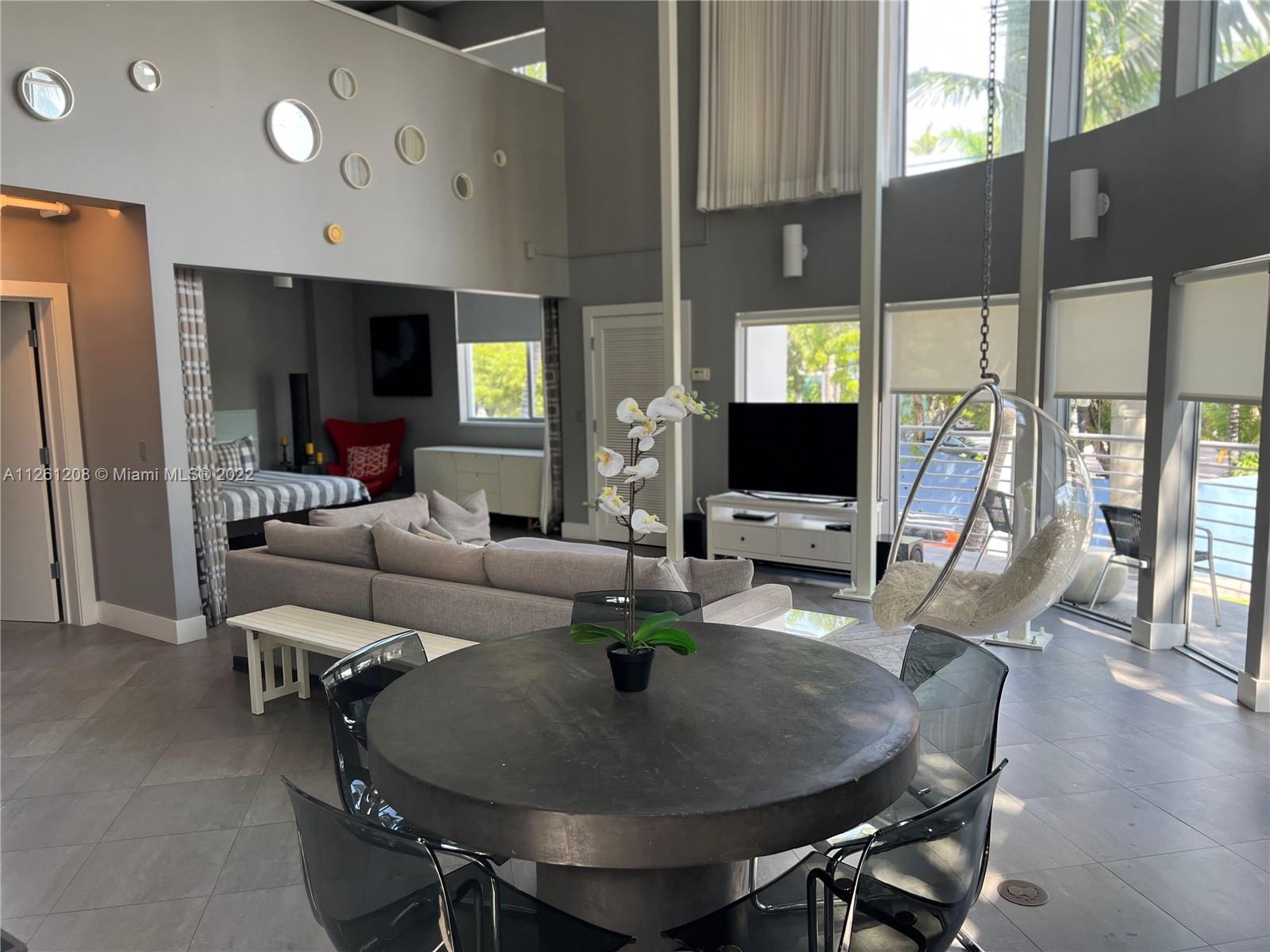 900 4th Street, Unit 2 Miami Beach, FL 33139 - Photo 6 of 15 a living room with fireplace furniture and a flat screen tv