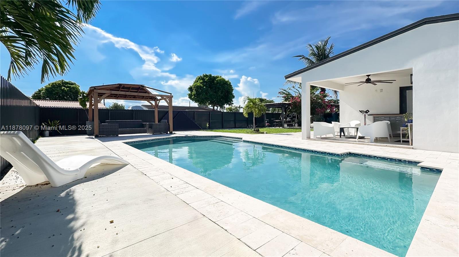 10370 Southwest 34th Street Miami, FL 33165 - Photo 11 of 47 a view of a swimming pool with a patio