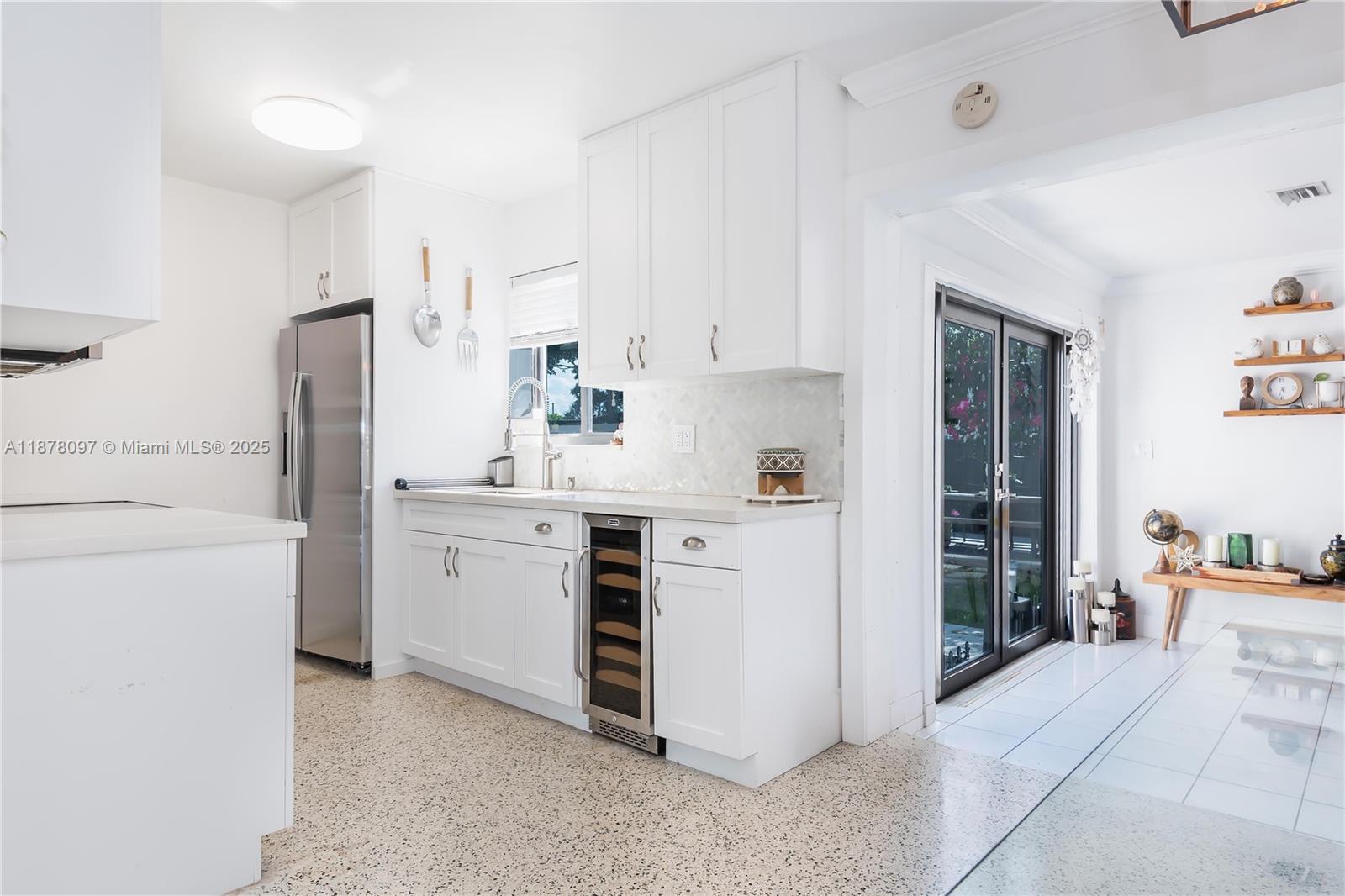 10370 Southwest 34th Street Miami, FL 33165 - Photo 14 of 47 a kitchen with white cabinets and white appliances