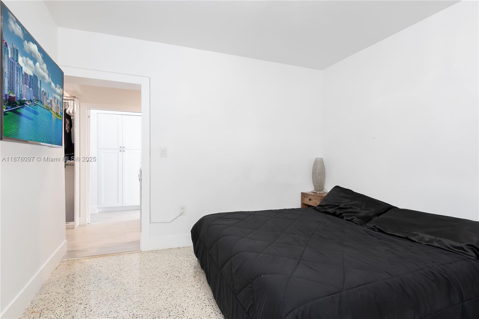 10370 Southwest 34th Street Miami, FL 33165 - Photo 21 of 47 a bedroom with a bed and a book shelf
