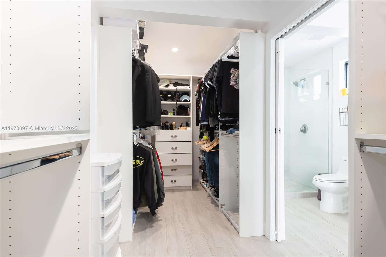 10370 Southwest 34th Street Miami, FL 33165 - Photo 24 of 47 a view of walk in closet with clothes and shoes