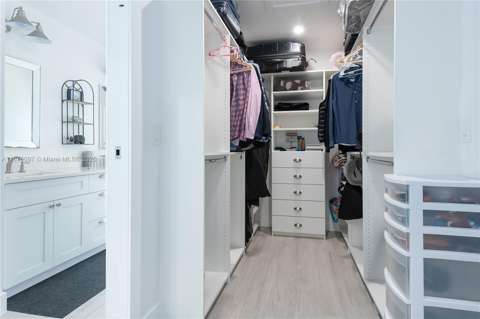 10370 Southwest 34th Street Miami, FL 33165 - Photo 25 of 47 a view of walk in closet with clothes and shoes