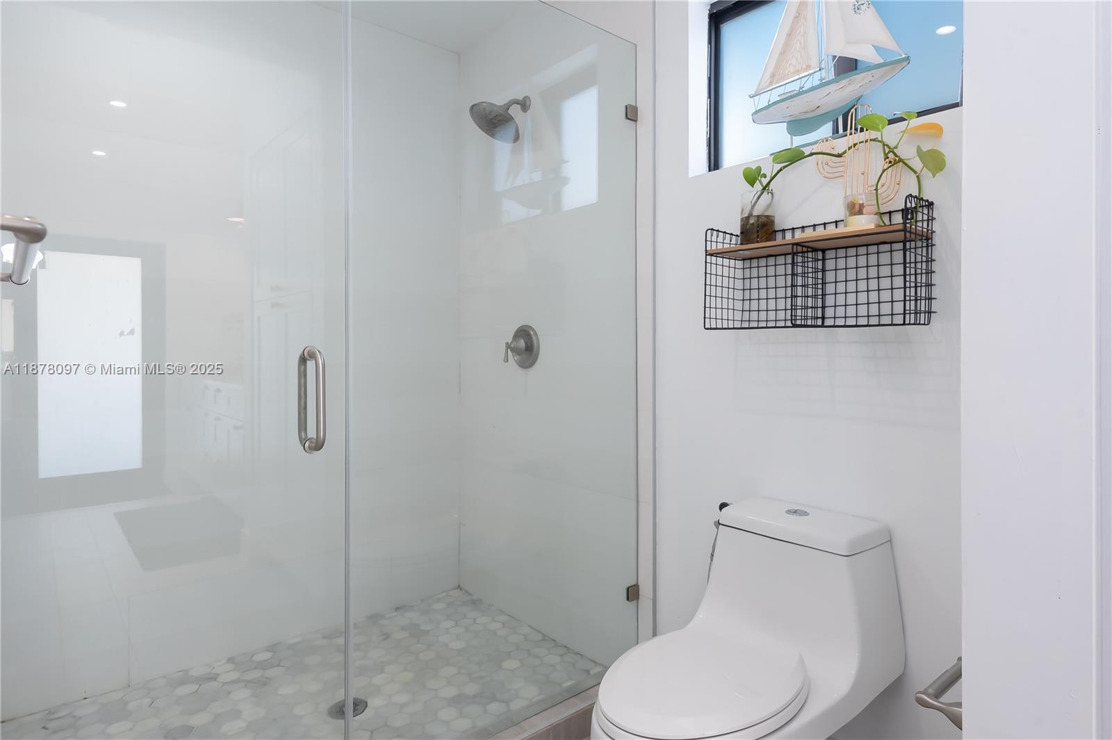 10370 Southwest 34th Street Miami, FL 33165 - Photo 26 of 47 a white toilet sitting next to a bathroom sink