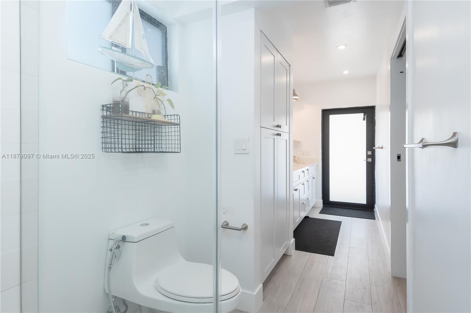 10370 Southwest 34th Street Miami, FL 33165 - Photo 29 of 47 a bathroom with a sink a toilet and shower