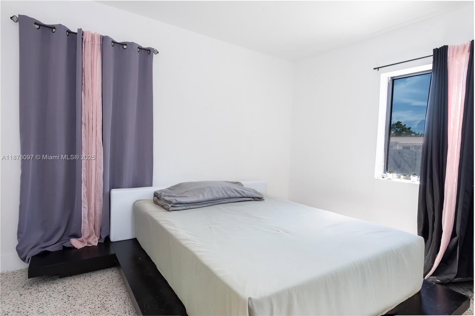 10370 Southwest 34th Street Miami, FL 33165 - Photo 30 of 47 a bedroom with a bed and a window