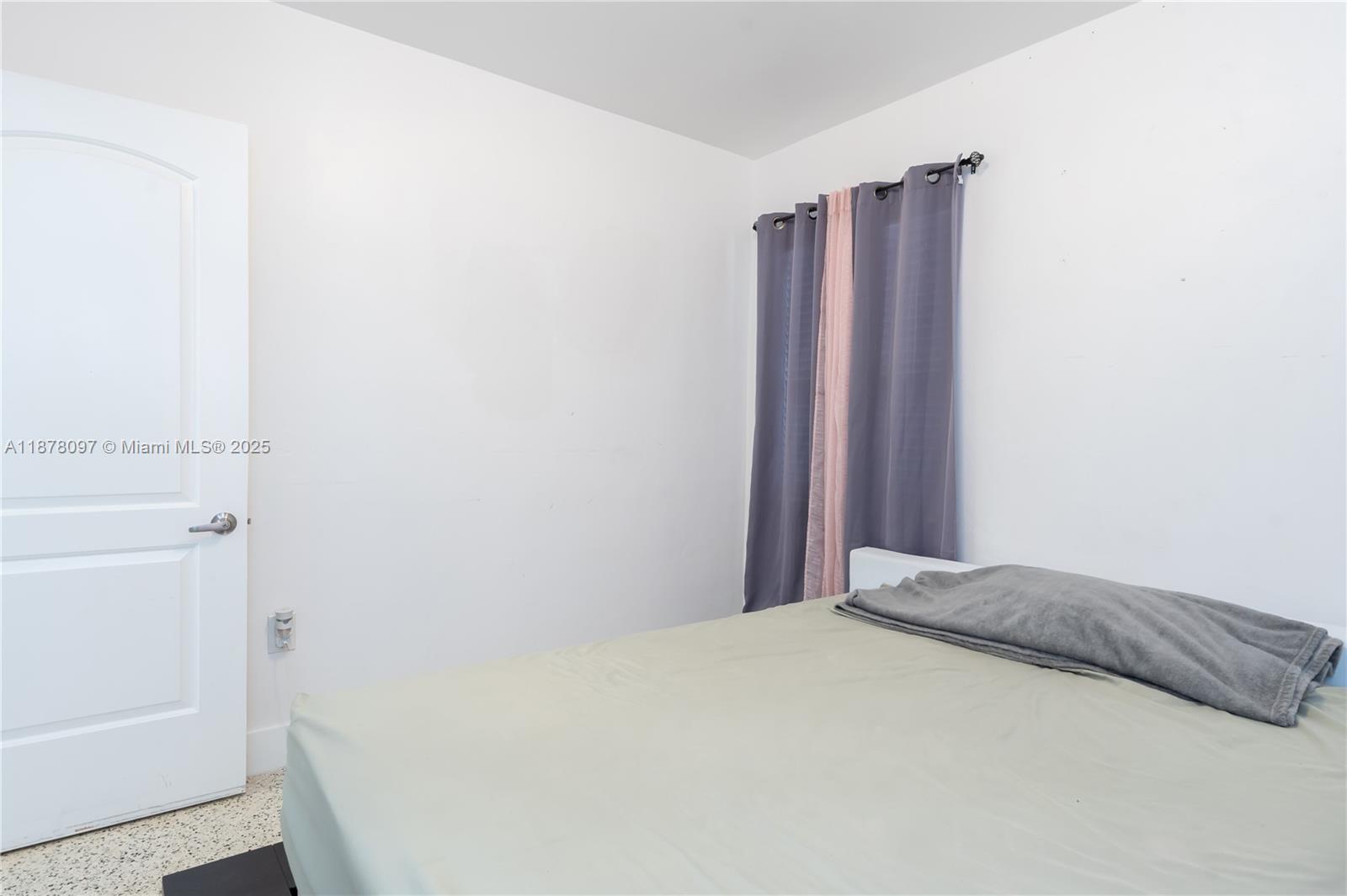 10370 Southwest 34th Street Miami, FL 33165 - Photo 31 of 47 a bedroom with a bed and a window