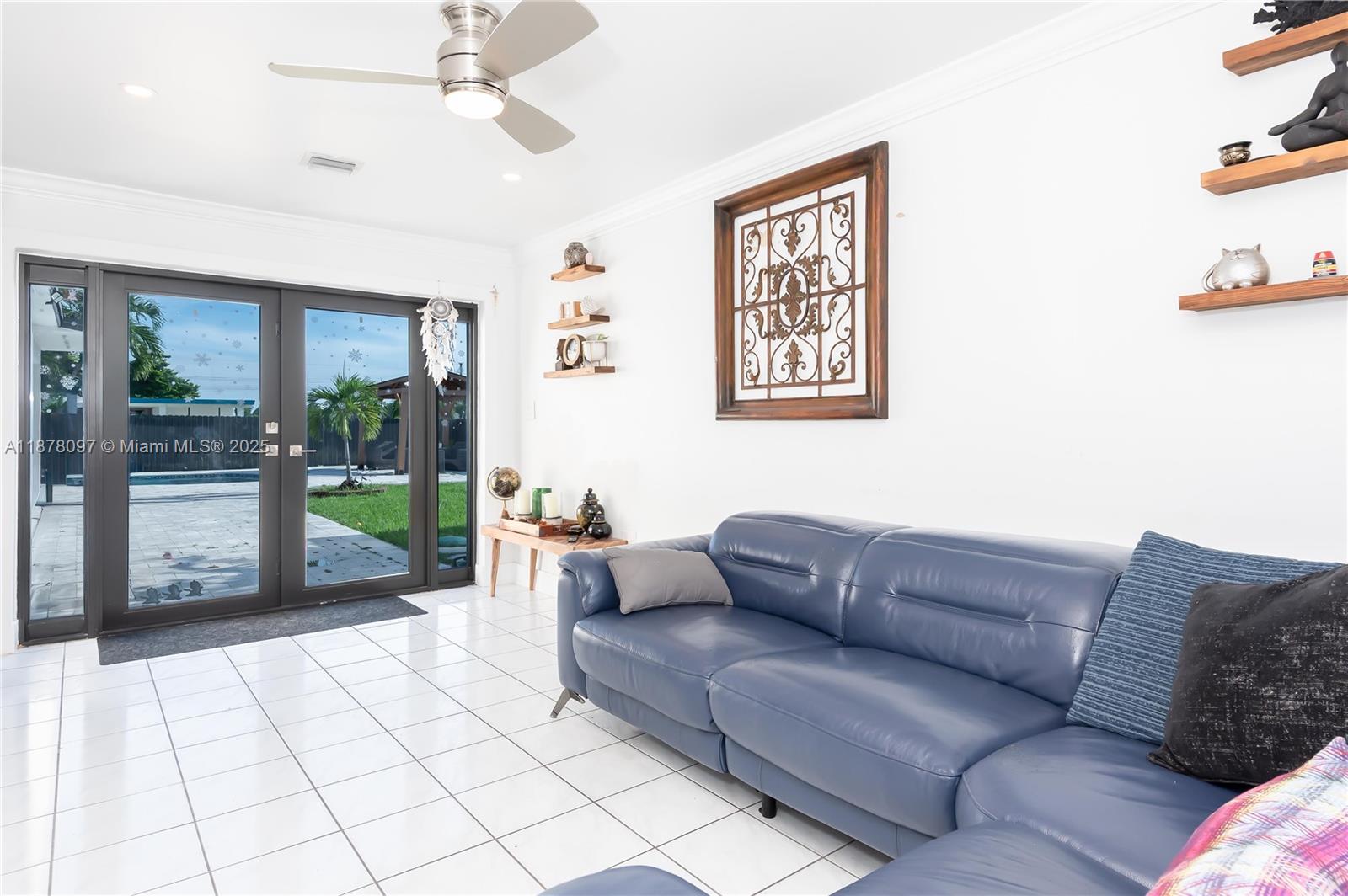 10370 Southwest 34th Street Miami, FL 33165 - Photo 36 of 47 a living room with furniture and a flat screen tv