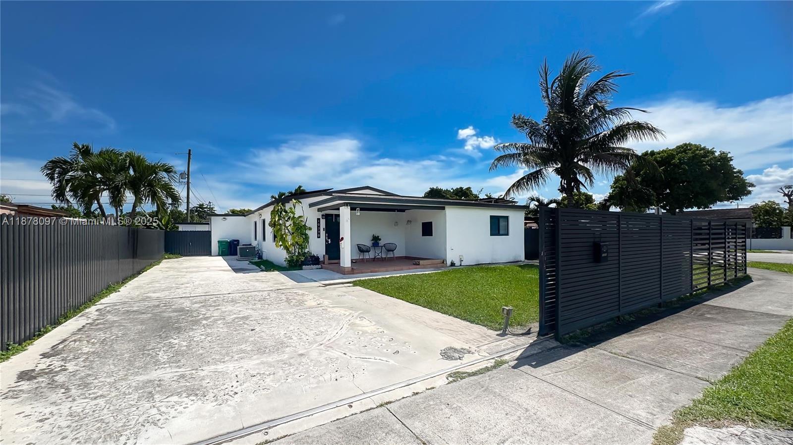 10370 Southwest 34th Street Miami, FL 33165 - Photo 4 of 47 a front view of a house with garden