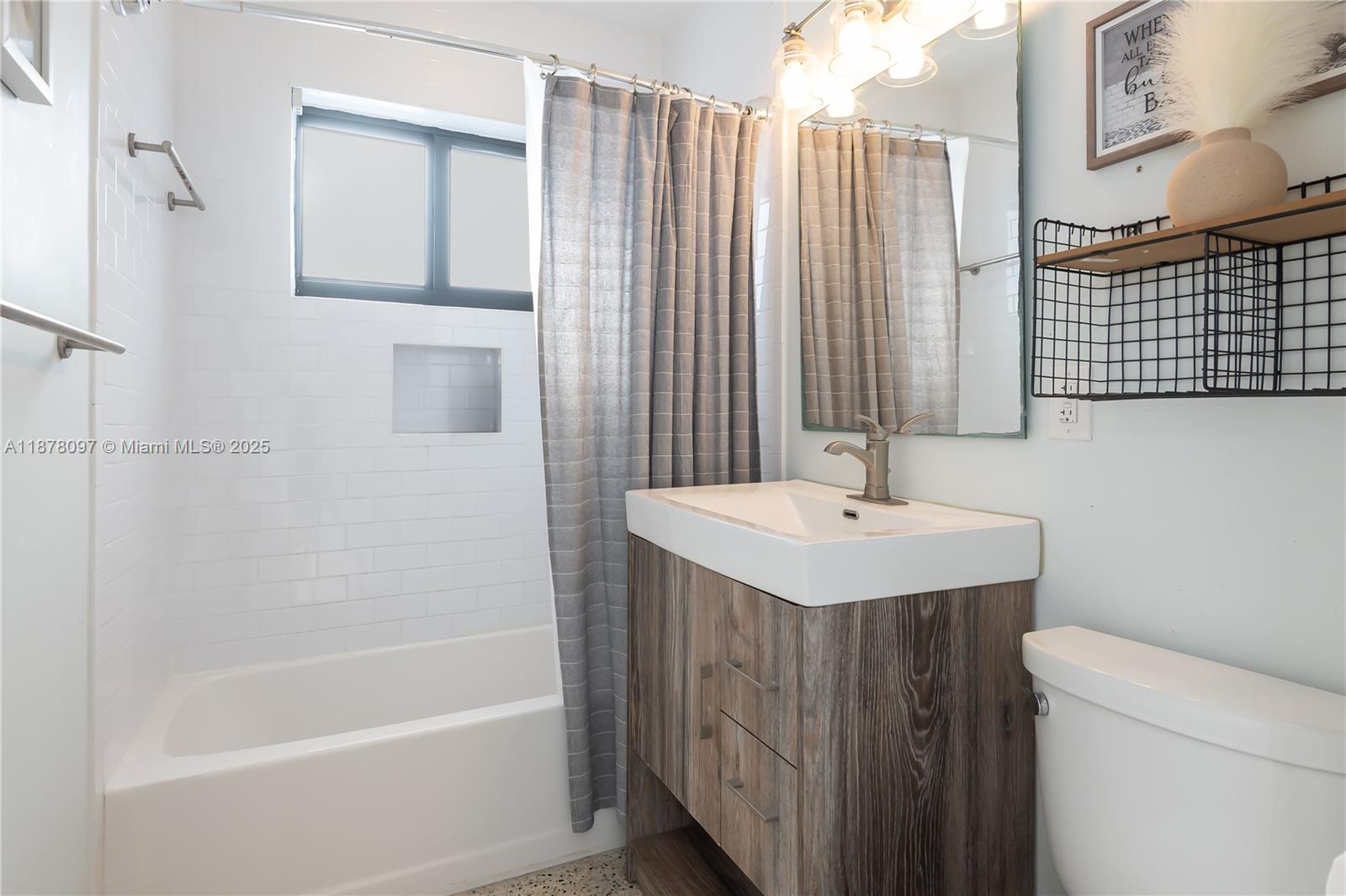 10370 Southwest 34th Street Miami, FL 33165 - Photo 41 of 47 a bathroom with a sink a toilet and shower