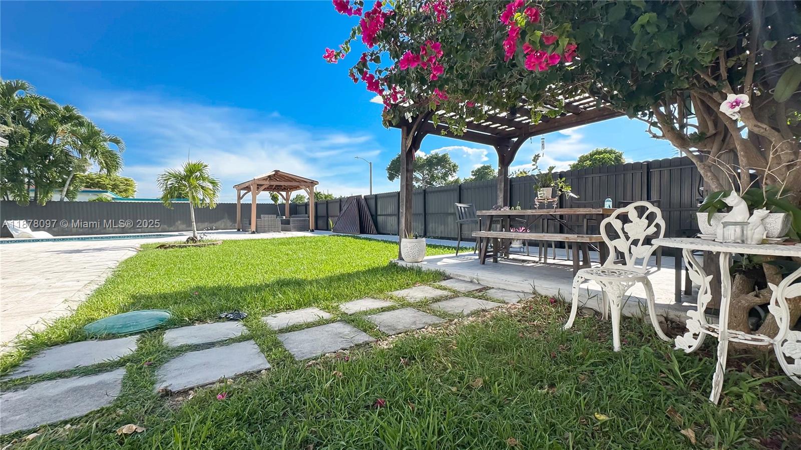10370 Southwest 34th Street Miami, FL 33165 - Photo 7 of 47 a view of a chairs and table in the patio