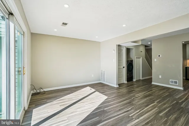 a view of a livingroom with wooden floor