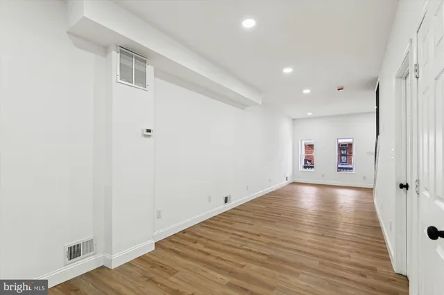 a kitchen with stainless steel appliances a refrigerator sink and cabinets