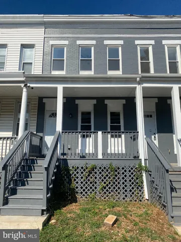 a black and white building with wooden floor