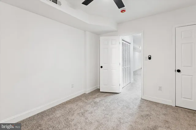 an empty room with fan