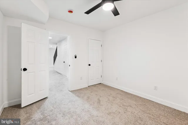 a view of a pathway with a wrought fence