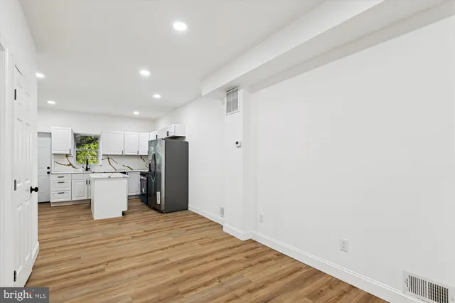 a view of a livingroom with wooden floor
