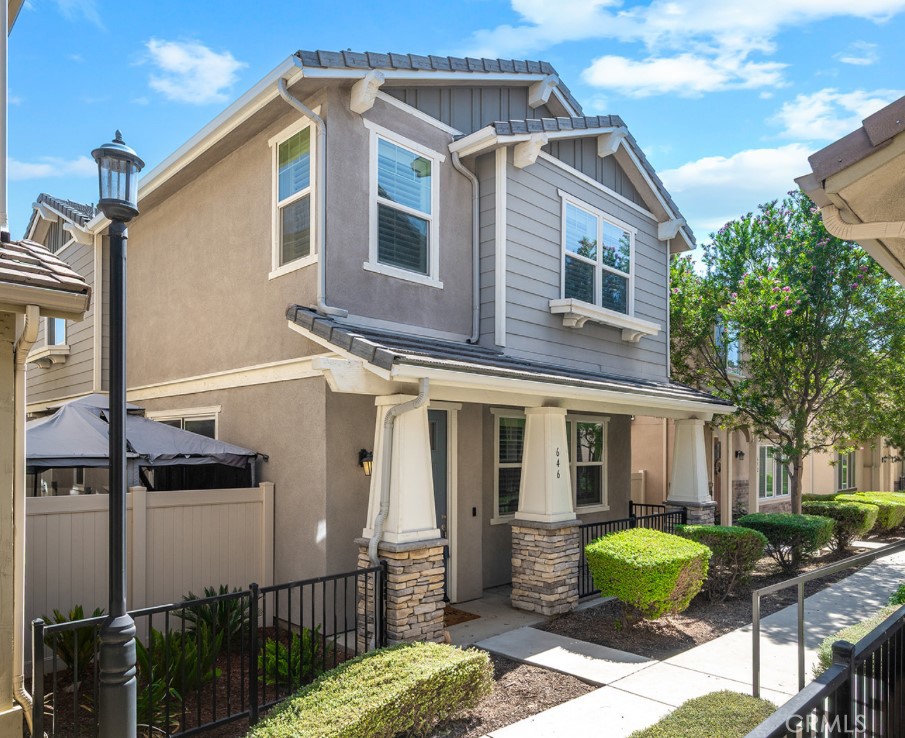 a front view of a house with garden