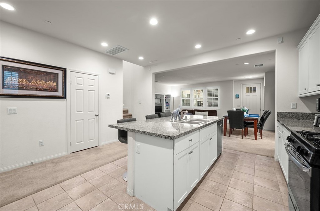 646 South Fillmore Avenue Rialto, CA 92376 - Photo 12 of 46 a large kitchen with stainless steel appliances a large counter top