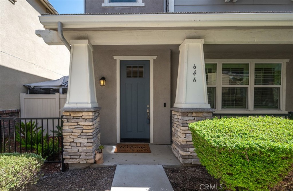 646 South Fillmore Avenue Rialto, CA 92376 - Photo 2 of 46 a front view of a house with a garden