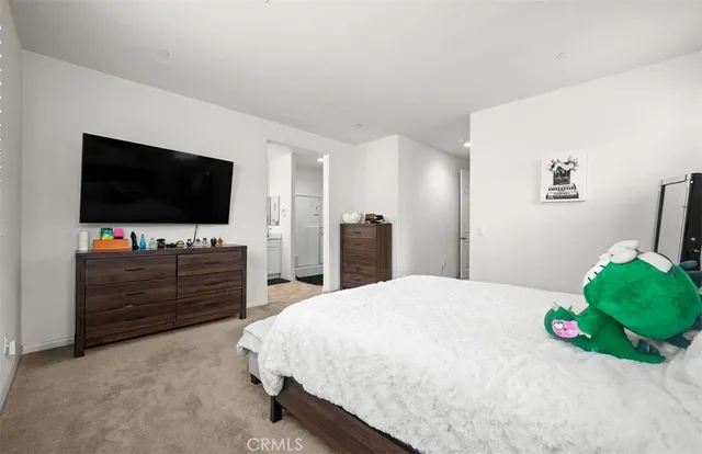 a room with a bed and a flat screen tv in it