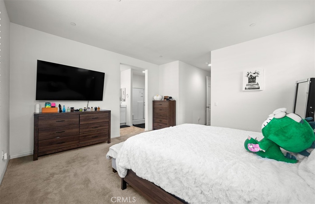 646 South Fillmore Avenue Rialto, CA 92376 - Photo 21 of 46 a room with a bed and a flat screen tv in it