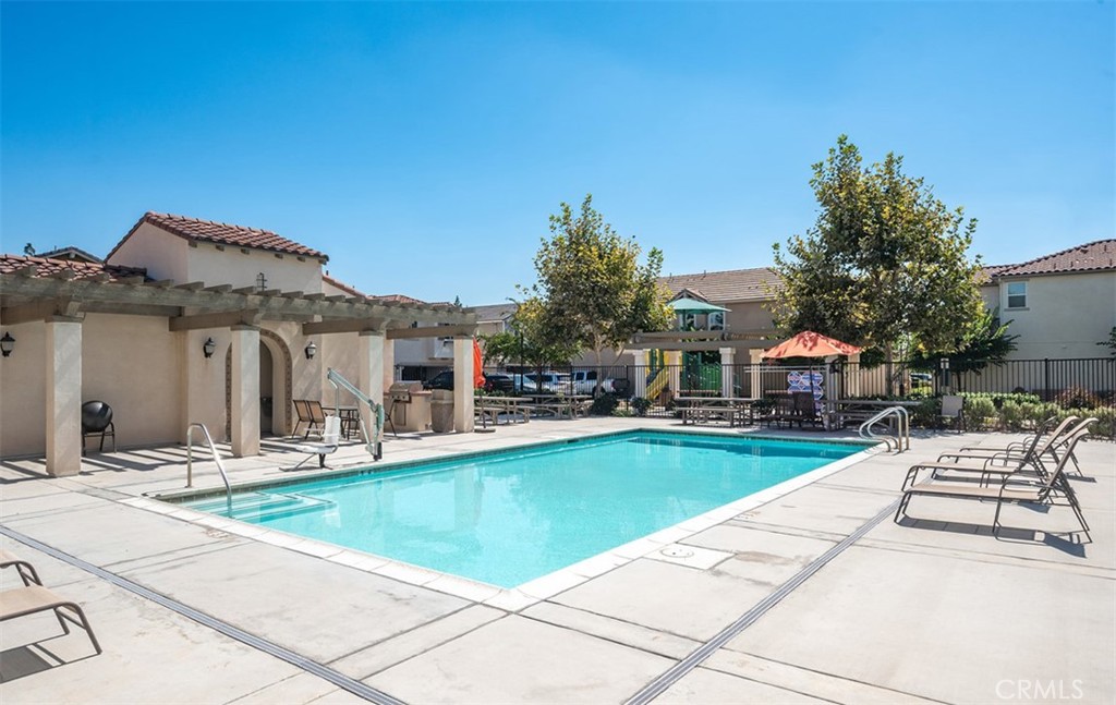 646 South Fillmore Avenue Rialto, CA 92376 - Photo 39 of 46 a view of a house with swimming pool and sitting area