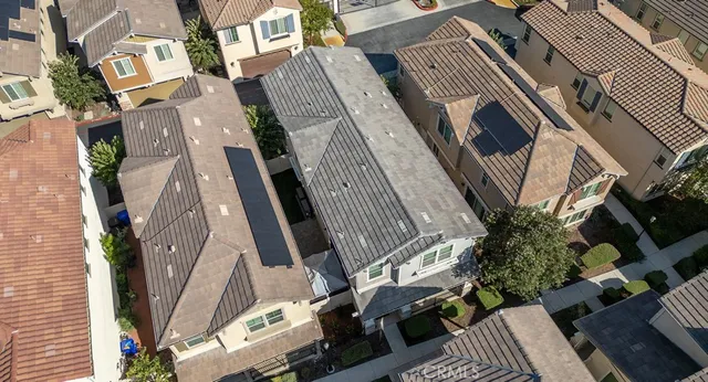 an aerial view of a house with outdoor space