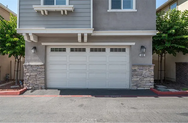 a front view of a house with garage