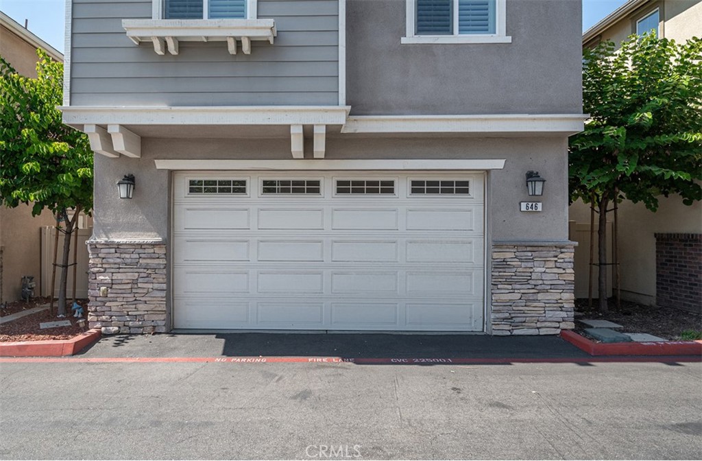 646 South Fillmore Avenue Rialto, CA 92376 - Photo 46 of 46 a front view of a house with garage