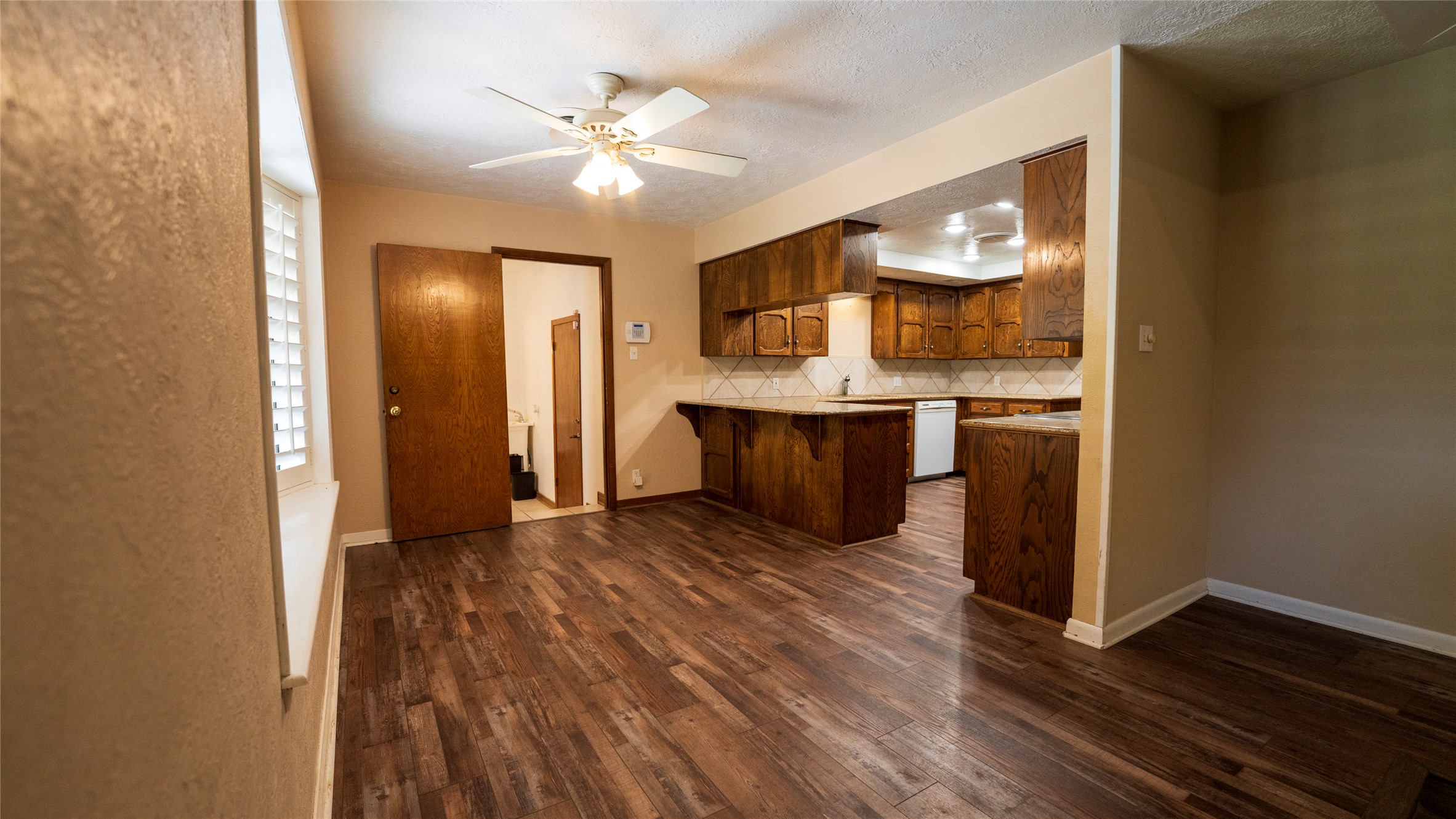 2105 Yokley Road Rockdale, TX 76567 - Photo 12 of 38 an empty room with wooden floor and cabinet