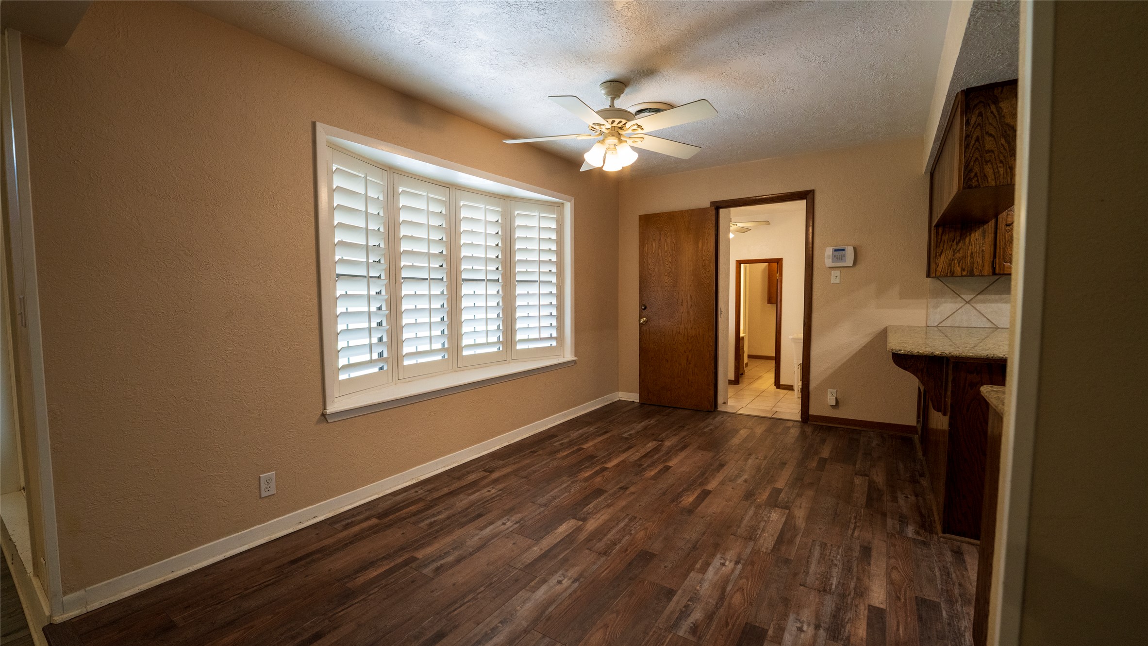2105 Yokley Road Rockdale, TX 76567 - Photo 14 of 38 a view of an empty room with wooden floor and a window