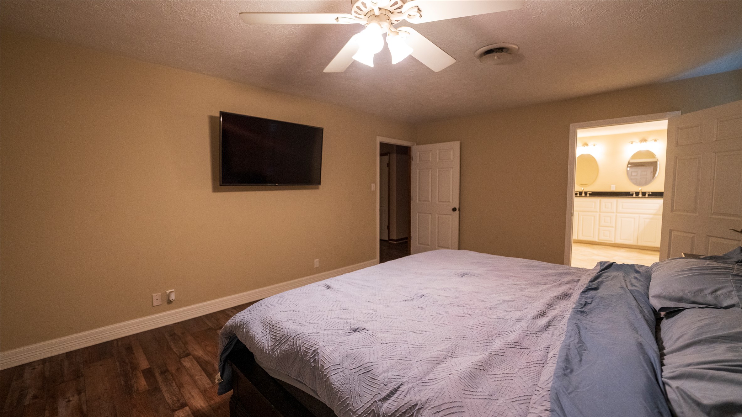 2105 Yokley Road Rockdale, TX 76567 - Photo 18 of 38 a bedroom with a bed and a flat screen tv
