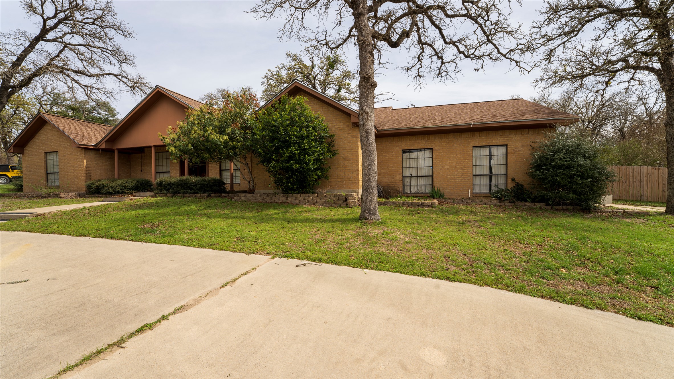 2105 Yokley Road Rockdale, TX 76567 - Photo 19 of 38 a front view of a house with a yard and garage