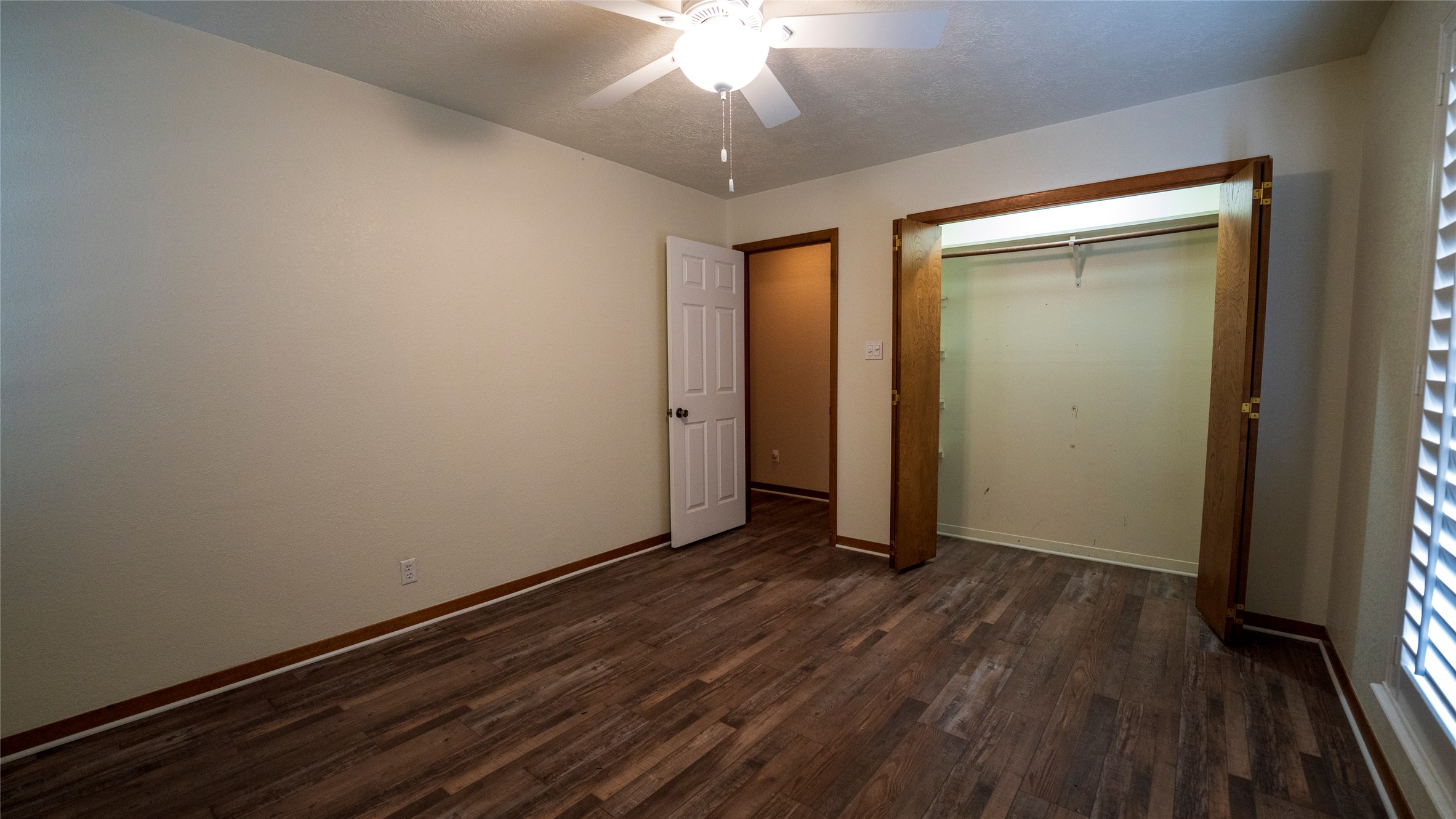 2105 Yokley Road Rockdale, TX 76567 - Photo 23 of 38 an empty room with wooden floor closet and windows