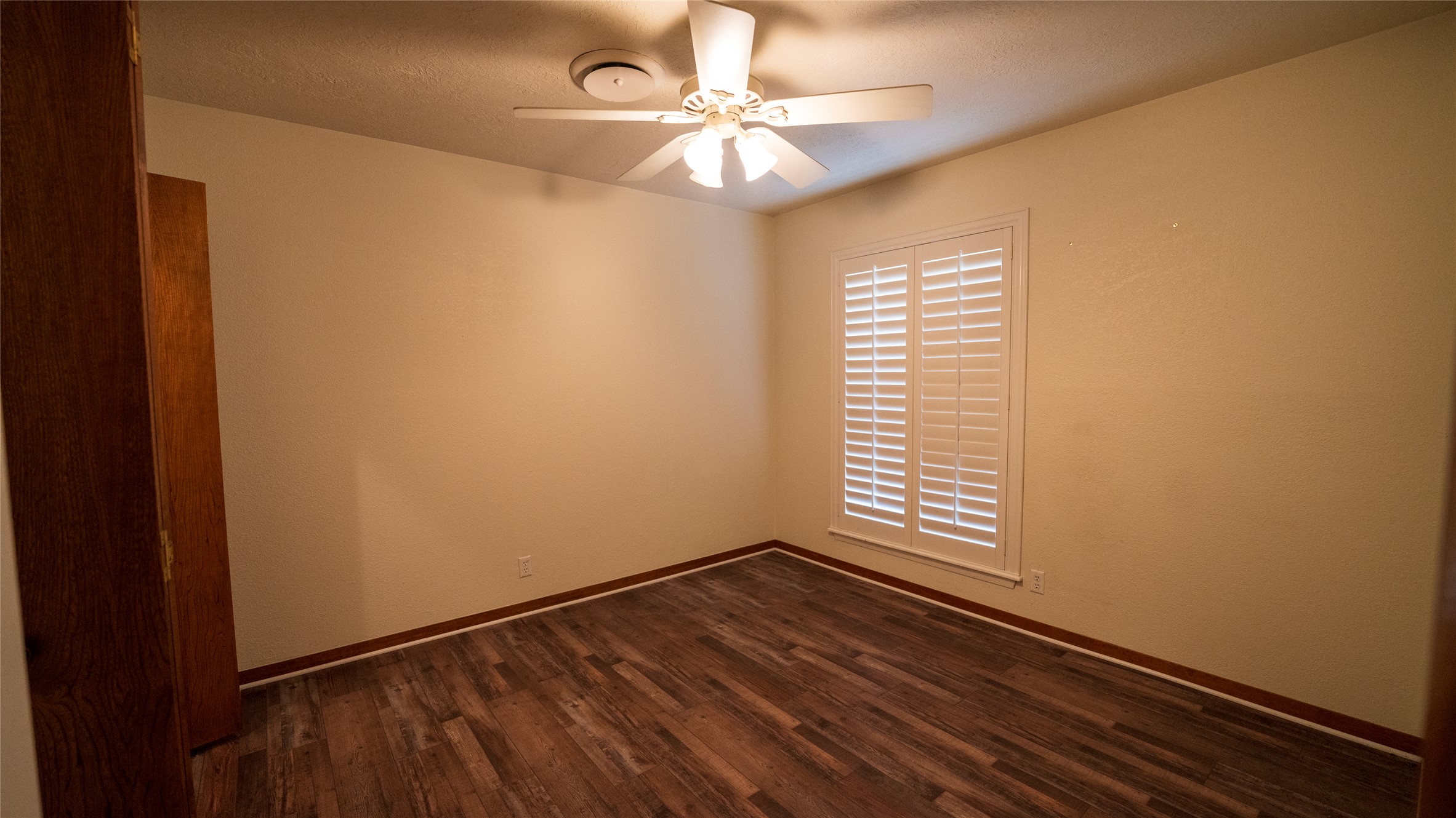 2105 Yokley Road Rockdale, TX 76567 - Photo 25 of 38 a view of an empty room with window and wooden floor