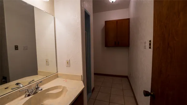 a bathroom with a sink and a mirror