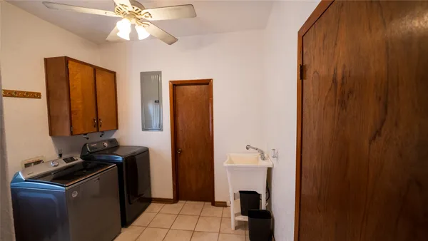 a room with a sink and a mirror