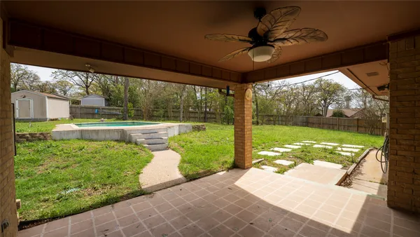 a view of a porch and garden